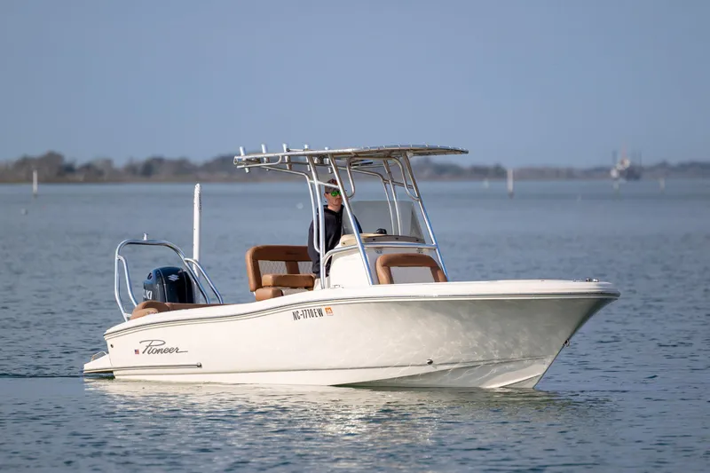 Slide: The Image of 2022 Pioneer 202 Islander boat cruising on calm water. - 6