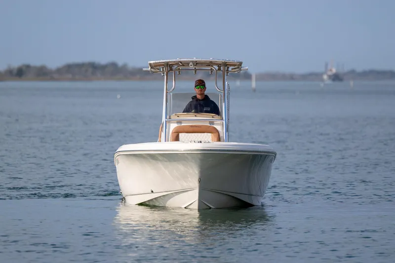 Slide: The Image of 2022 Pioneer 202 Islander boat cruising on calm water. - 7