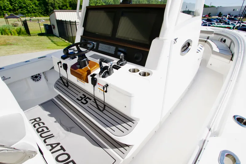 Slide: The Image of The image shows the cockpit of a Regulator 35 boat with controls and instruments. - 22
