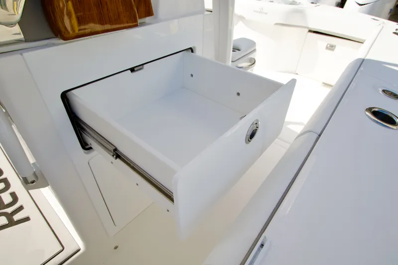 Slide: The Image of Open storage compartment on a 2027 Regulator 35 boat. - 28