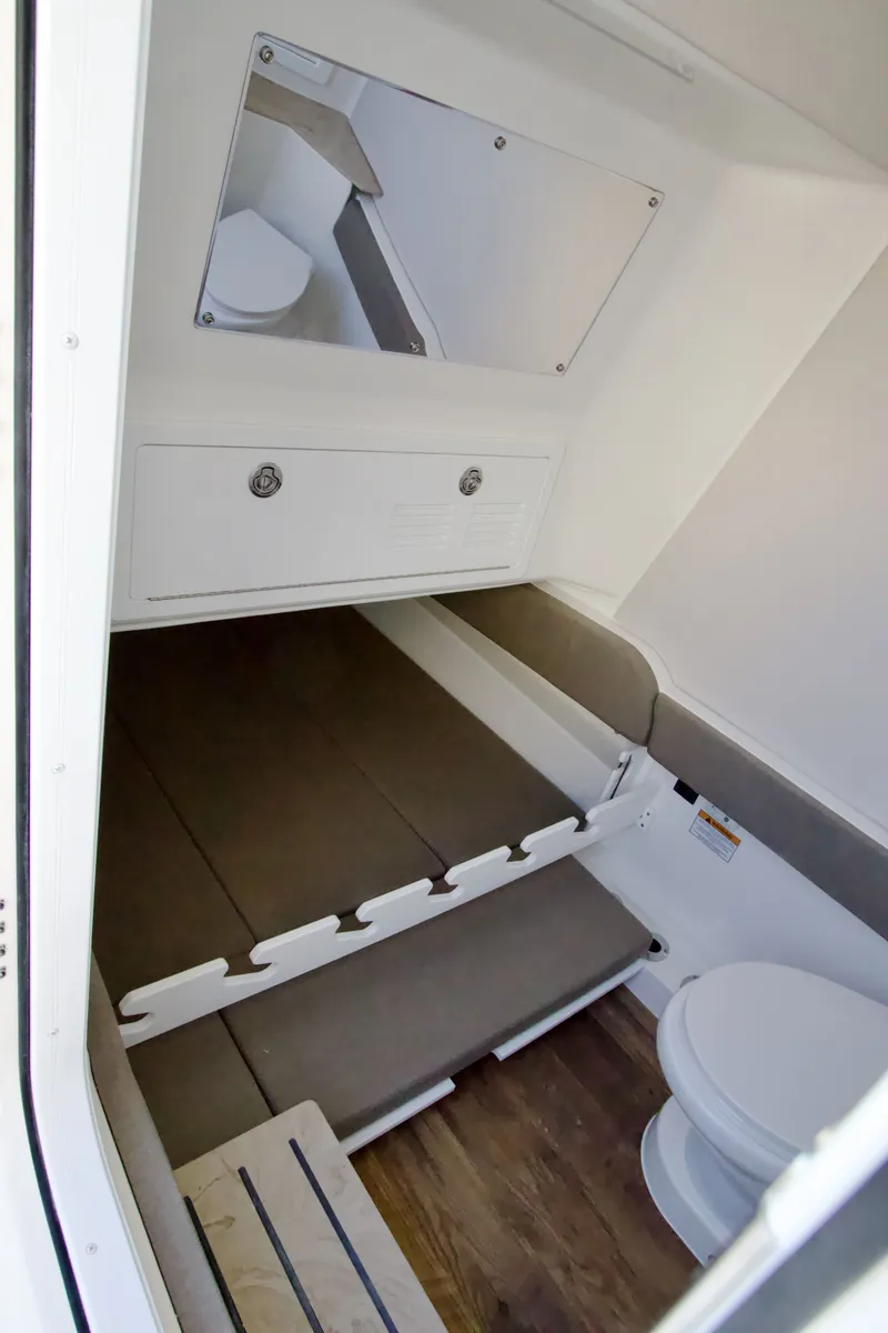 Slide: The Image of Interior of the 2027 Regulator 35 with seating area and toilet. - 20