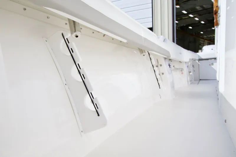 Slide: The Image of Interior view of a 2027 Regulator 35 boat with smooth white deck and walls. - 18