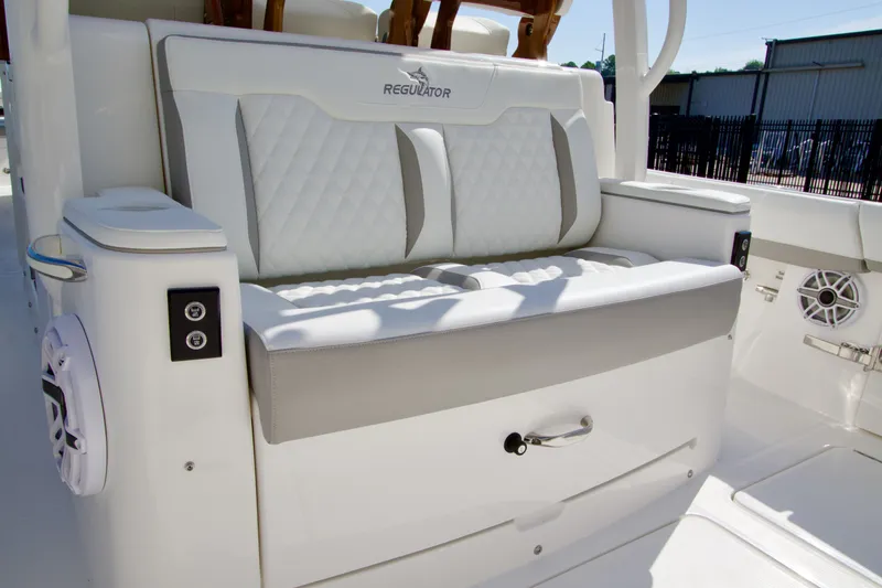 Slide: The Image of 2027 Regulator 35 featuring a luxurious cushioned bench seat and modern controls. - 35