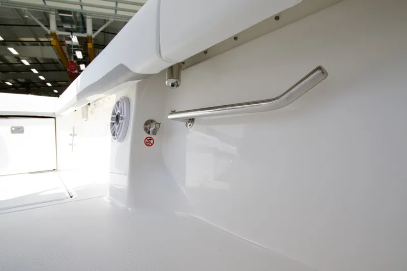Slide: The Image of Close-up of a Regulator 35 boat interior with stainless steel handle and speaker. - 26