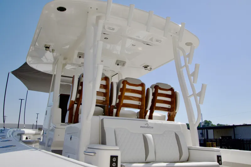 Slide: The Image of The image shows the cockpit of a Regulator 35 boat with sleek seating and a shaded canopy. - 45