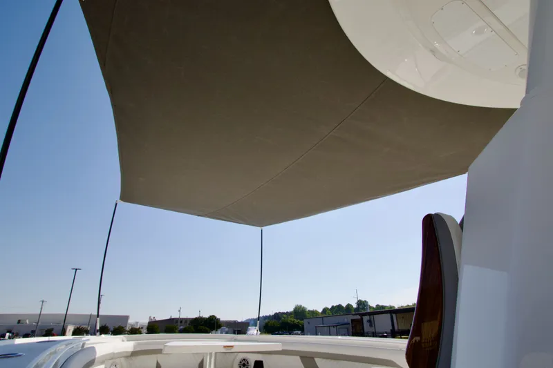 Slide: The Image of Sunshade on a Regulator 35 boat, overlooking the blue sky. - 13