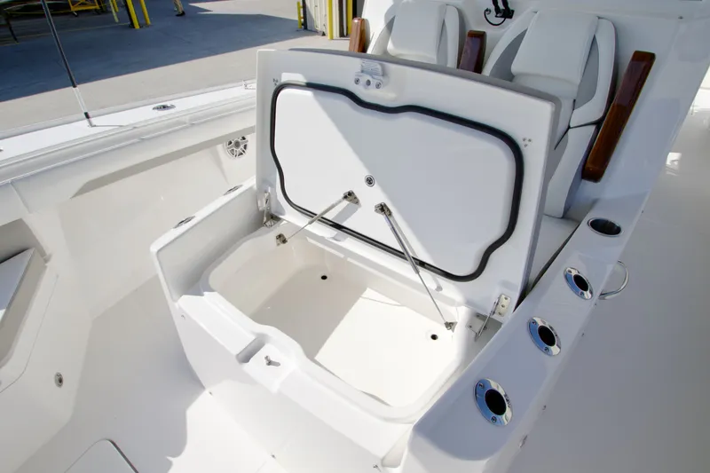 Slide: The Image of The image shows the open storage compartment of a 2027 Regulator 35 boat. - 15