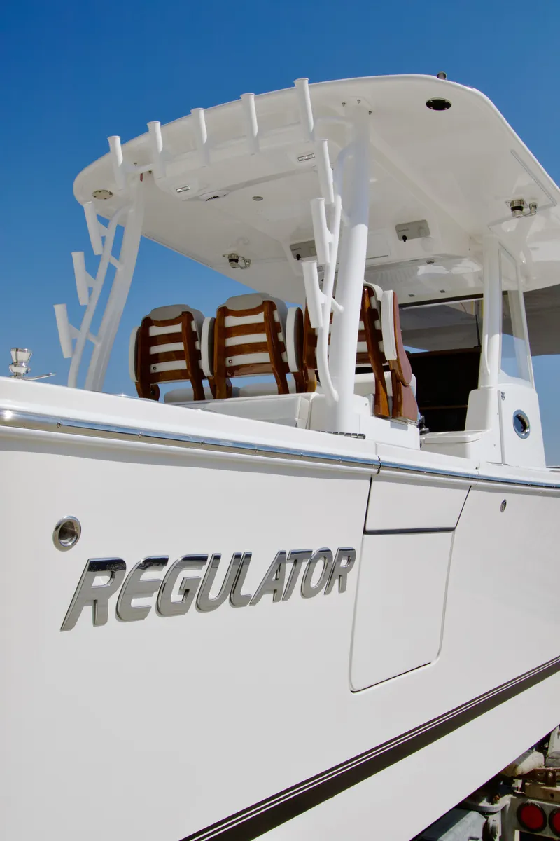 Slide: The Image of Regulator 35 from 2027 with a white hull and sleek lines. - 44