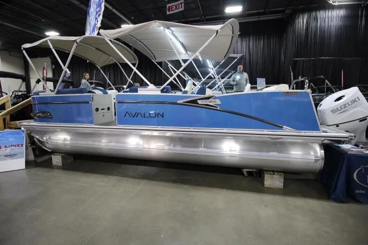 The Image of 2026 Avalon Catalina Versatile Rear Lounge pontoon boat displayed indoors. - 0