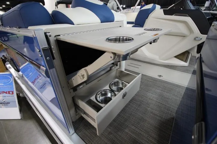 Slide: The Image of 2026 Avalon Catalina Versatile Rear Lounge with fold-out table and cup holders. - 10