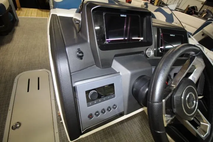 Slide: The Image of 2026 Avalon Catalina boat dashboard with steering wheel and control panel. - 14