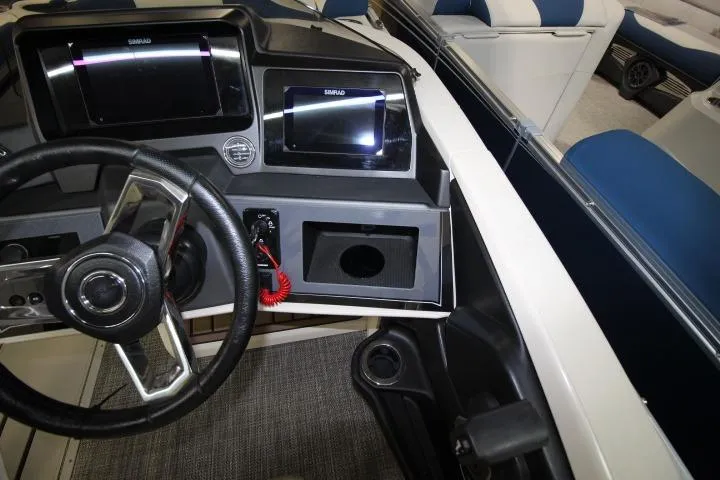 Slide: The Image of Interior dashboard of 2026 Avalon Catalina Versatile Rear Lounge boat, featuring modern controls. - 15