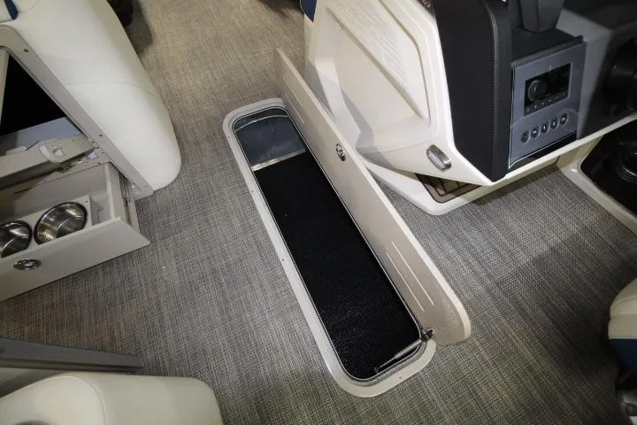 Slide: The Image of 2026 Avalon Catalina Versatile Rear Lounge boat interior with open storage compartment. - 16