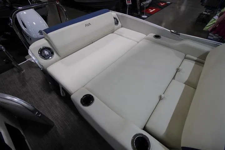 Slide: The Image of 2026 Avalon Catalina Versatile Rear Lounge boat interior with plush seating and cup holders. - 17
