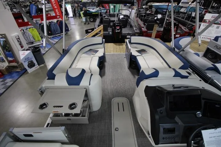 Slide: The Image of 2026 Avalon Catalina Versatile Rear Lounge boat interior at a showroom display. - 8