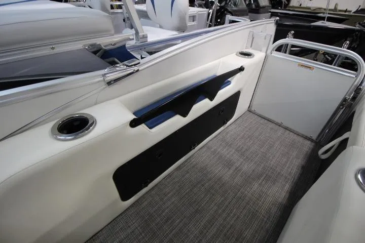 Slide: The Image of 2026 Avalon Catalina Versatile Rear Lounge boat interior with sleek seating and cup holders. - 9