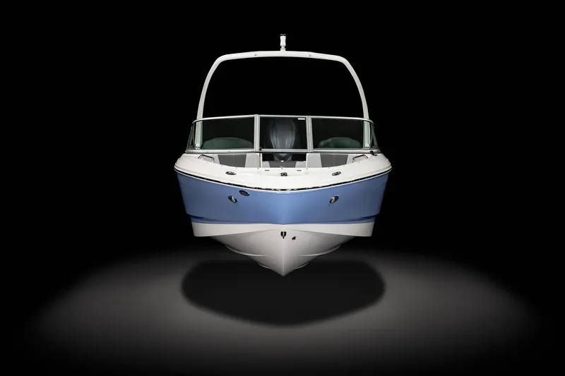 Slide: The Image of 2025 Chaparral 21 SSi OB boat, front view, sleek design, blue and white color scheme. - 1