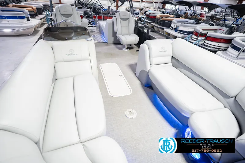 Slide: The Image of Interior of a 2017 Bennington 220 LE3 pontoon boat with plush seating. - 13