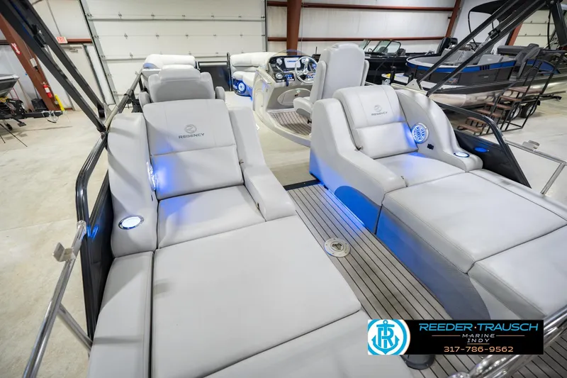 Slide: The Image of Luxurious interior of 2017 Bennington 220 LE3 pontoon boat with plush seating and ambient lighting. - 15