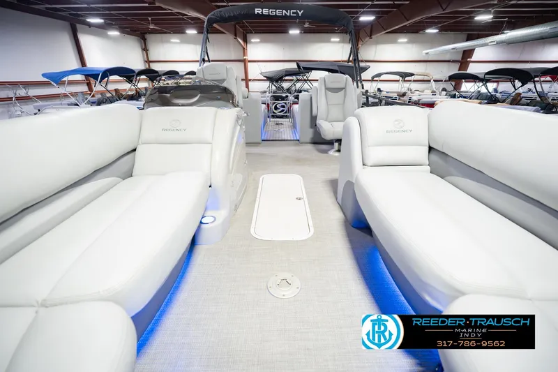 Slide: The Image of Interior of a 2017 Bennington 220 LE3 pontoon boat with plush seating. - 16