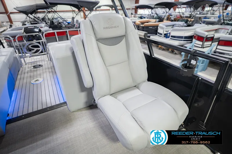 Slide: The Image of Luxurious seating on a 2017 Bennington 220 LE3 pontoon boat, showcased indoors. - 23
