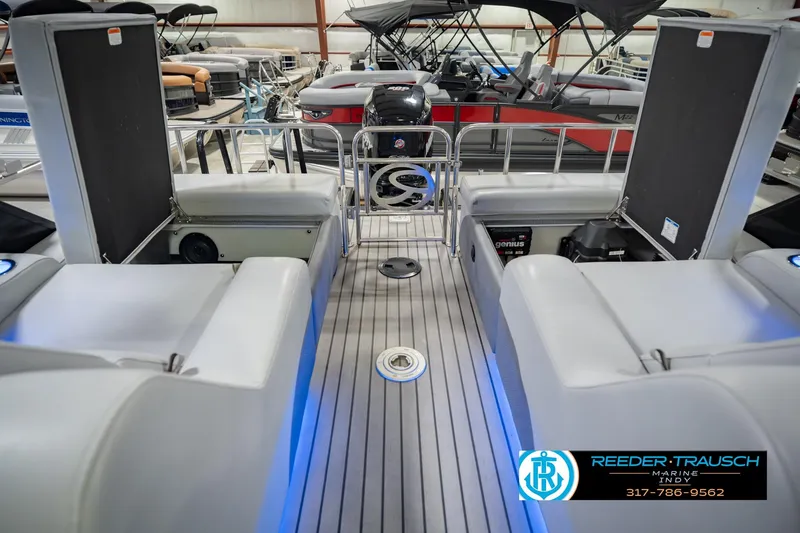 Slide: The Image of 2017 Bennington 220 LE3 pontoon boat interior with seating and steering wheel. - 26