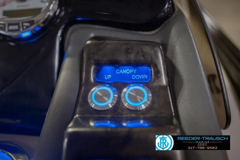 Slide: The Image of Control panel of a 2017 Bennington 220 LE3 boat with canopy adjustment buttons. - 36