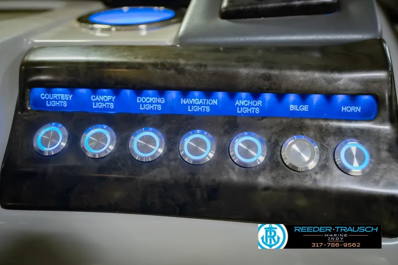 Slide: The Image of Control panel of a 2017 Bennington 220 LE3 boat with illuminated switches. - 38
