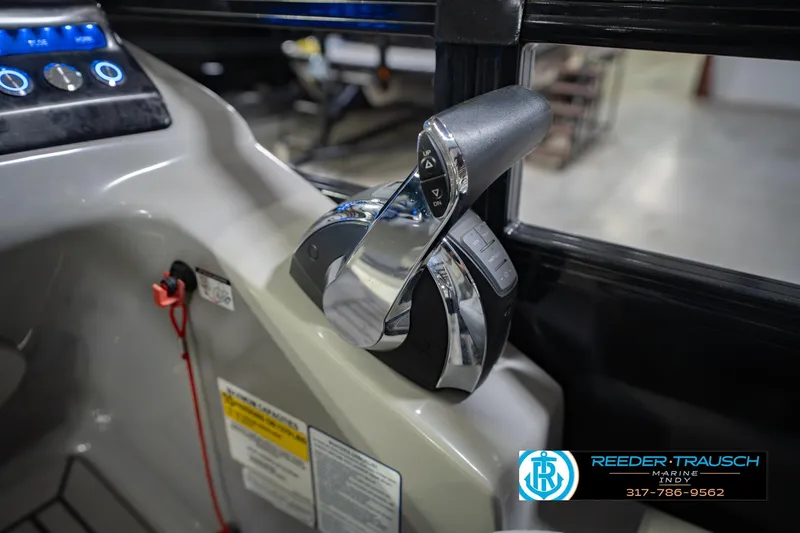 Slide: The Image of Close-up of 2017 Bennington 220 LE3 boat throttle control in cockpit. - 39