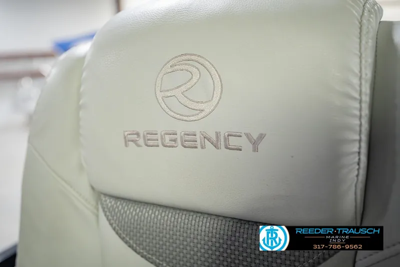 Slide: The Image of Close-up of Regency boat seat with logo, featuring Bennington 220 LE3, 2017 model. - 41