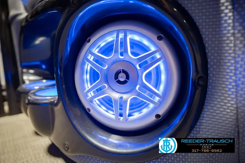 Slide: The Image of Illuminated speaker on a 2017 Bennington 220 LE3 pontoon boat, showcasing blue LED lighting. - 45