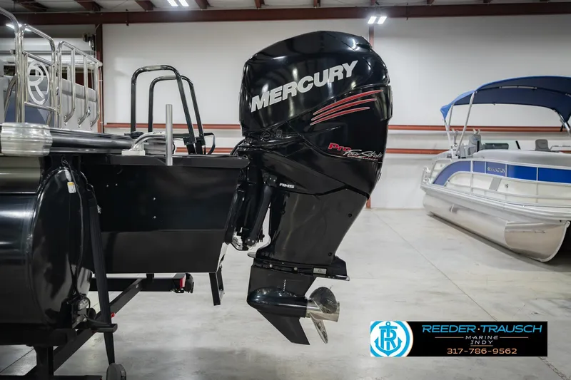 Slide: The Image of 2017 Bennington 220 LE3 with Mercury outboard motor in showroom. - 49