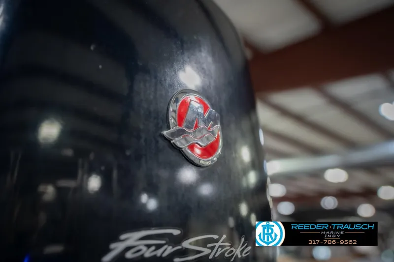 Slide: The Image of 2017 Bennington 220 LE3 emblem with "Four Stroke" text, indoor setting. - 54