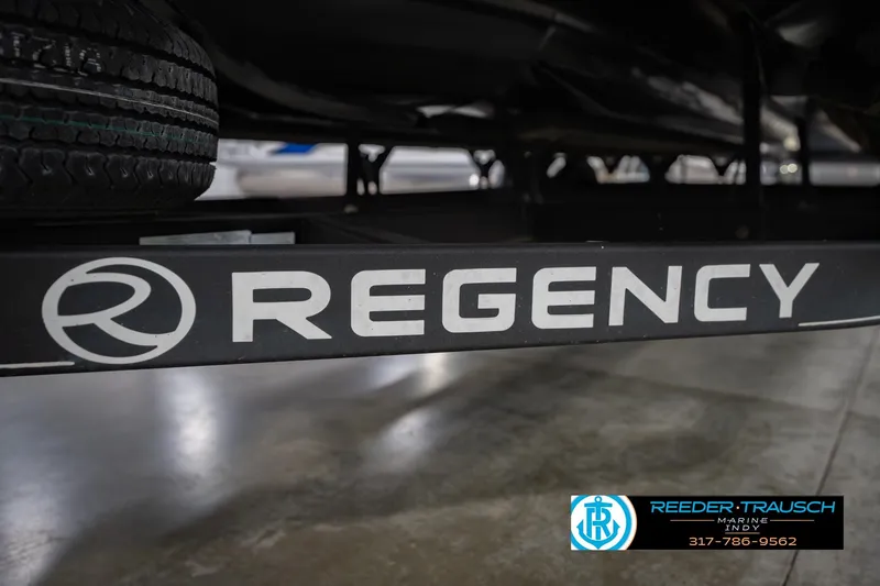 Slide: The Image of Trailer with "Regency" branding for a 2017 Bennington 220 LE3 boat. - 57