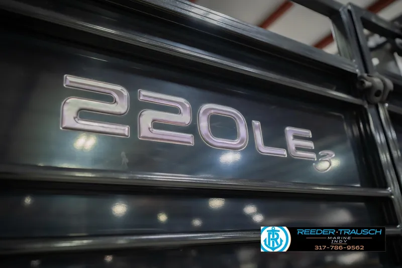 Slide: The Image of 2017 Bennington 220 LE3 boat model emblem with dealership contact information. - 58