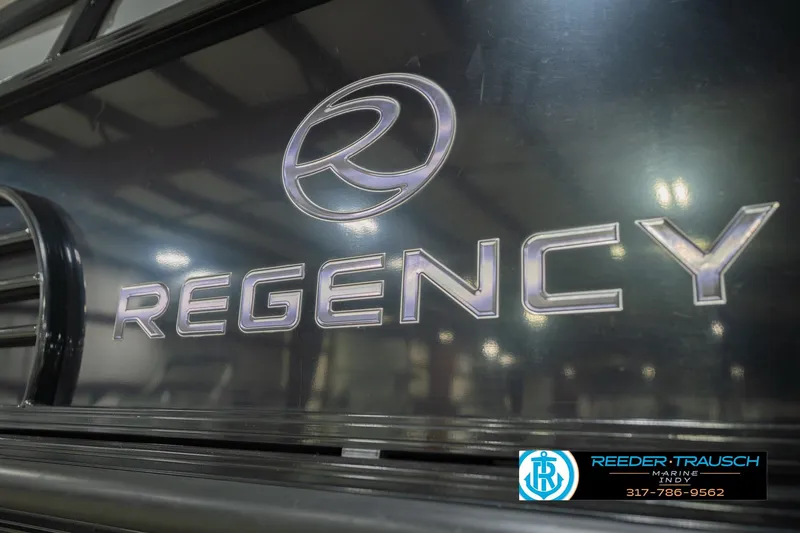 Slide: The Image of Close-up of Regency logo on 2017 Bennington 220 LE3 boat at Reeder Trausch Marine. - 59