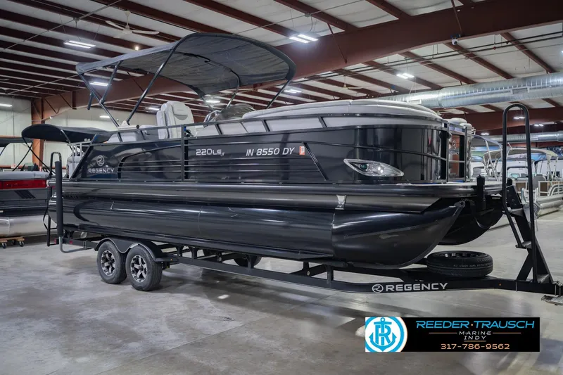 Slide: The Image of 2017 Bennington 220 LE3 pontoon boat on trailer in indoor showroom. - 6