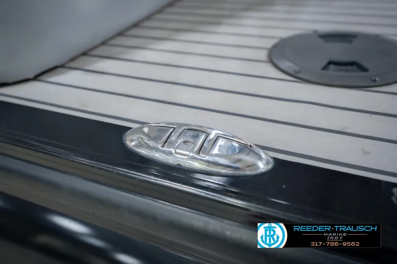 Slide: The Image of 2017 Bennington 220 LE3 boat deck with sleek metal cleat and striped flooring. - 60