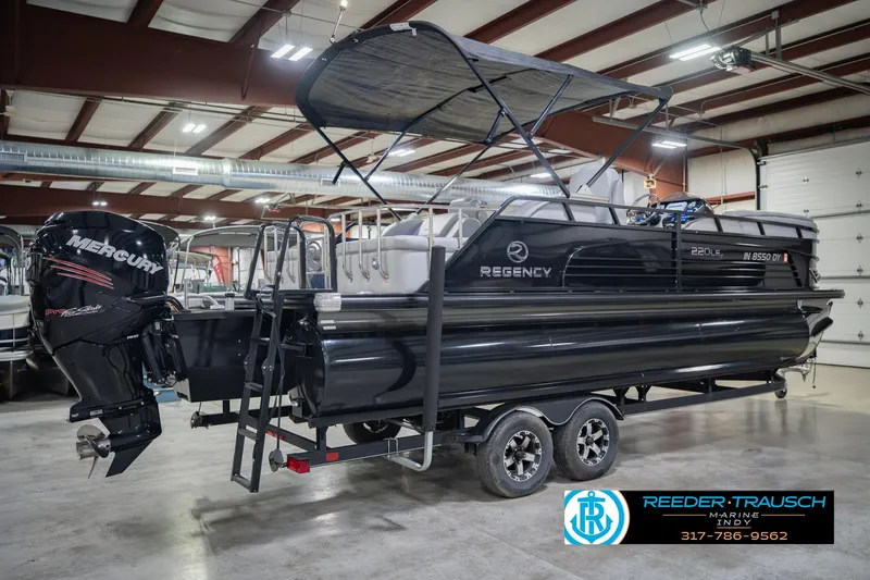 Slide: The Image of 2017 Bennington 220 LE3 pontoon boat with Mercury engine in indoor showroom. - 8
