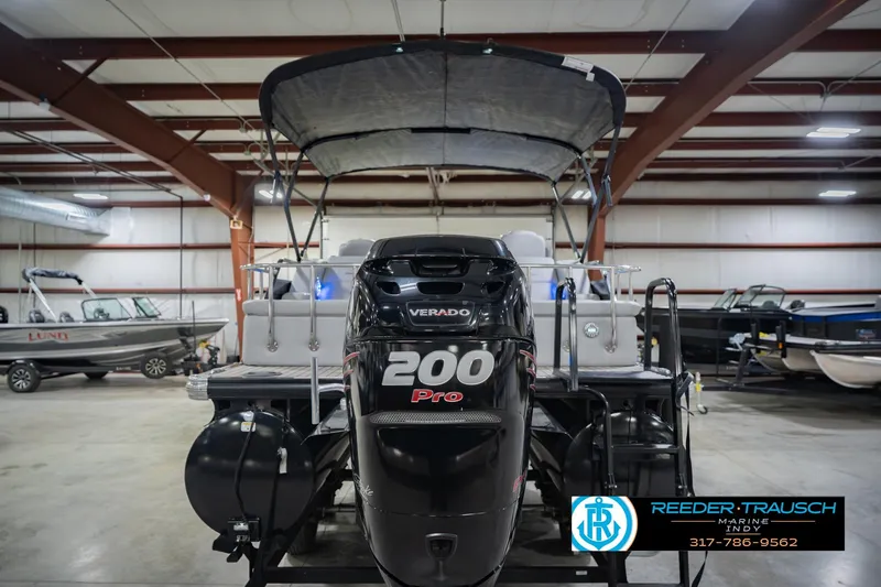 Slide: The Image of 2017 Bennington 220 LE3 pontoon boat with 200 Pro Verado engine in showroom. - 9