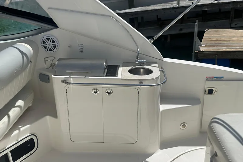 Slide: The Image of 2011 Sea Ray Sundancer 280 boat interior with kitchenette and sink. - 38