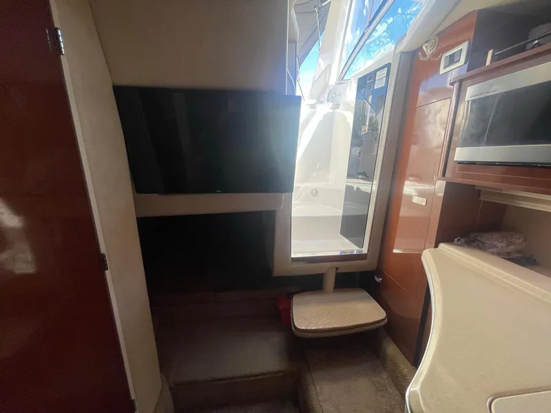 Slide: The Image of Interior of a 2011 Sea Ray Sundancer 280 yacht with modern amenities. - 45