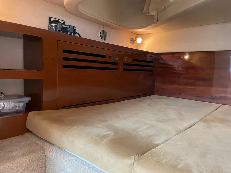 Slide: The Image of Interior of 2011 Sea Ray Sundancer 280 with wooden cabinetry. - 46