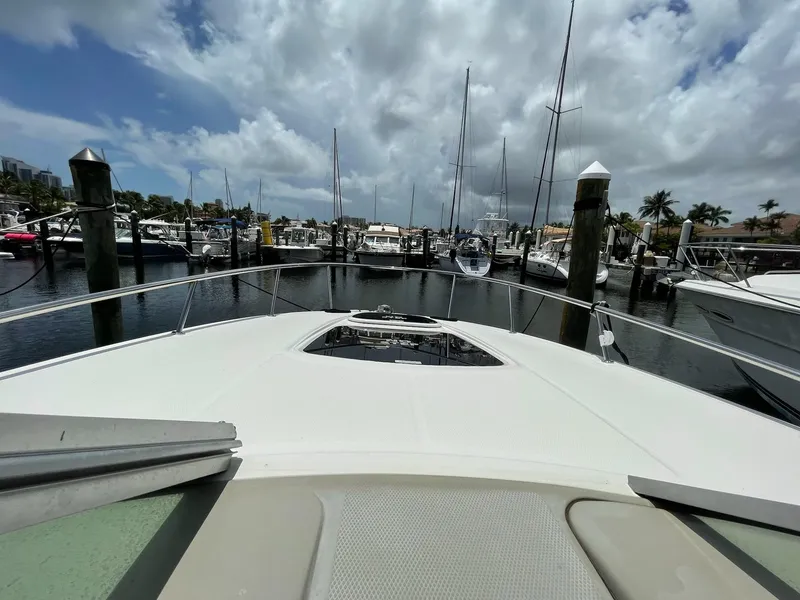 Slide: The Image of 2011 Sea Ray Sundancer 280 docked in marina under cloudy sky. - 5