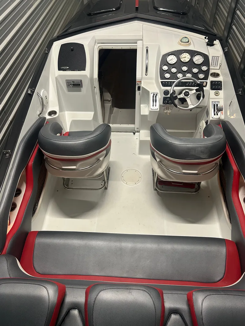 Slide: The Image of Interior of a 2006 Baja 30 Outlaw boat with steering console. - 22