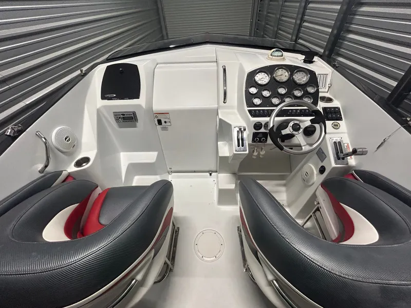 Slide: The Image of Interior view of a 2006 Baja 30 Outlaw boat with steering console. - 23