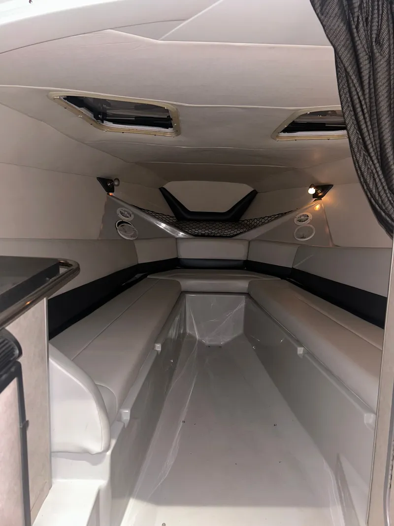 Slide: The Image of Interior of a 2006 Baja 30 Outlaw boat, modern and spacious. - 25
