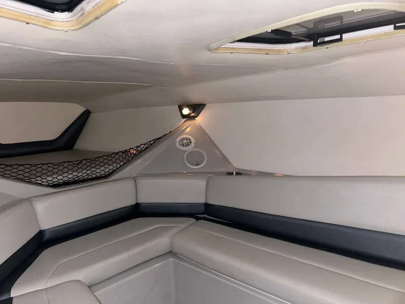 Slide: The Image of Interior of a 2006 Baja 30 Outlaw boat with seating area. - 26