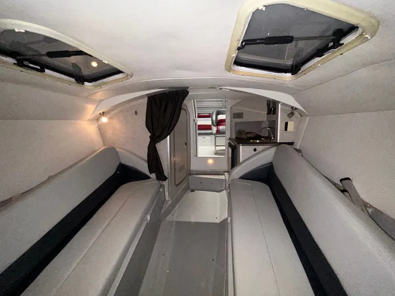 Slide: The Image of Interior of a 2006 Baja 30 Outlaw boat with seating benches. - 28