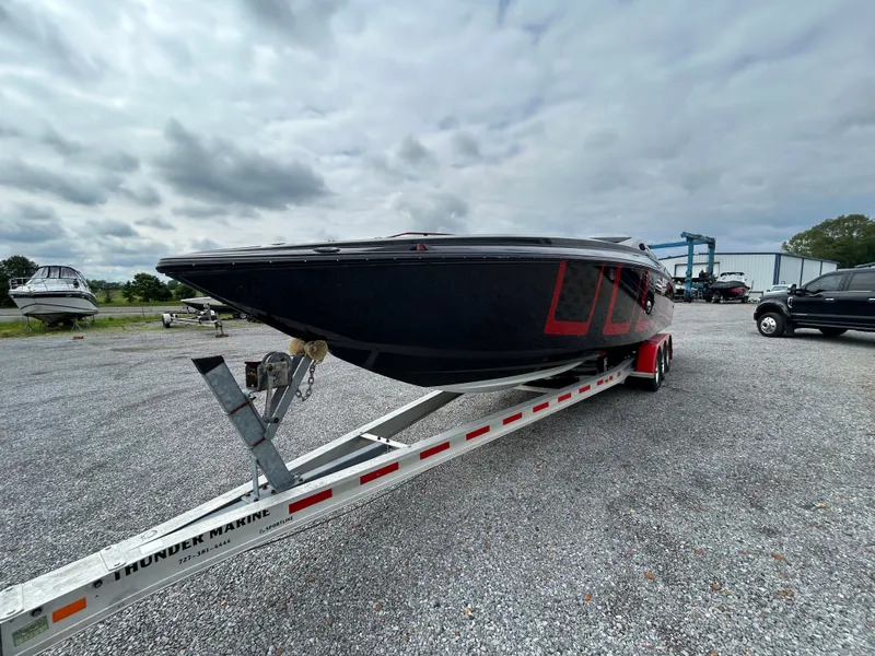 Slide: The Image of 2006 Baja 30 Outlaw boat on trailer under cloudy sky. - 3